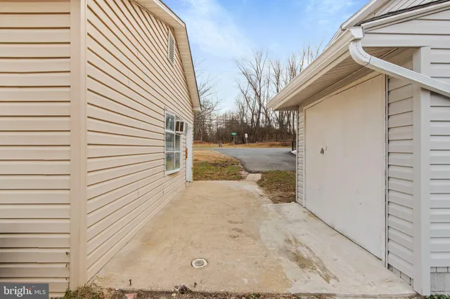 a view of a hallway with staircase