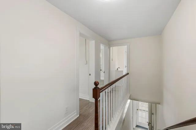 an empty room with wooden floor