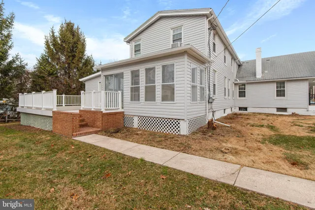 a view of a balcony with wooden floor