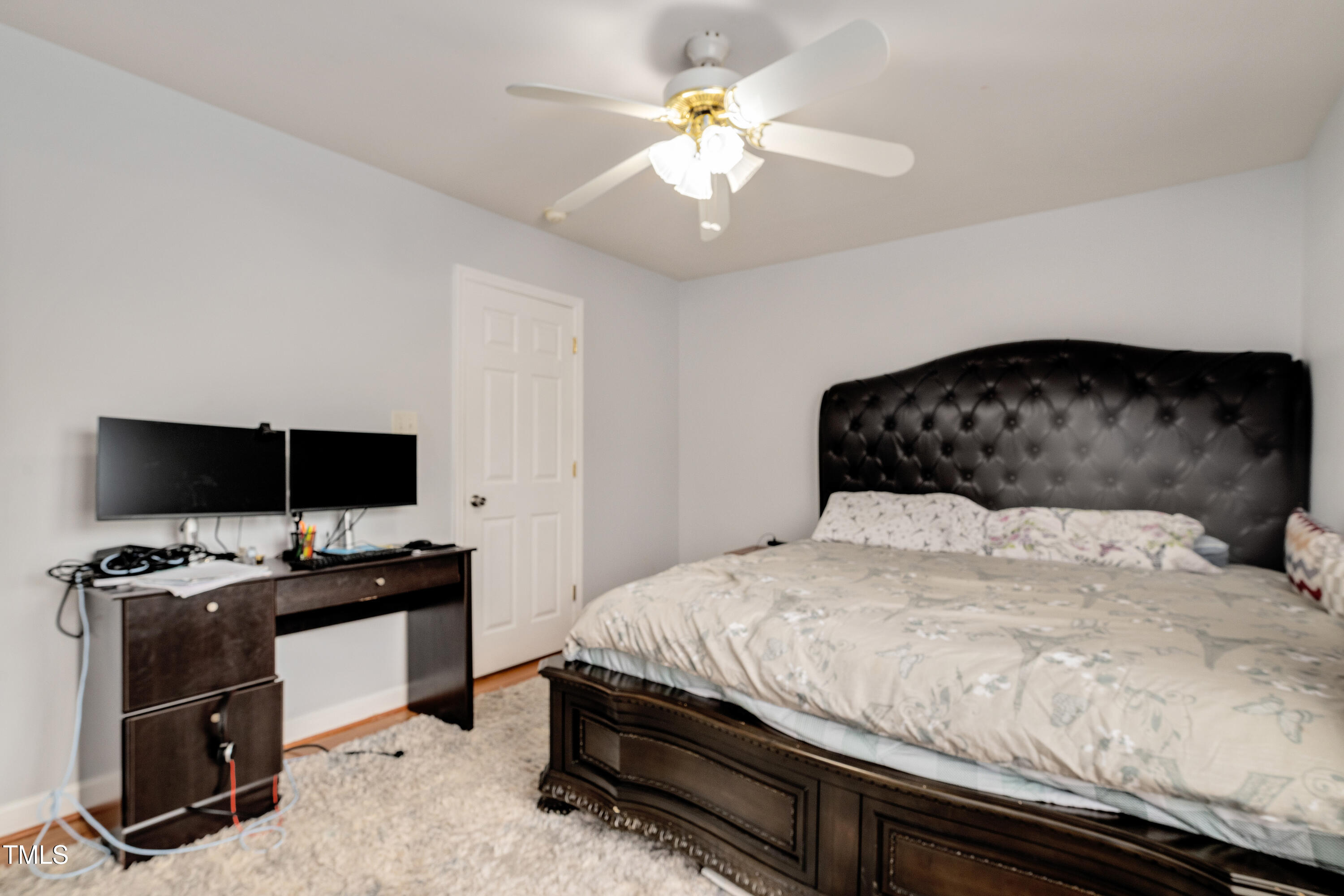 4809 Hallam Way Raleigh, NC 27616 - Photo 10 of 30 a bedroom with a bed and a flat screen tv