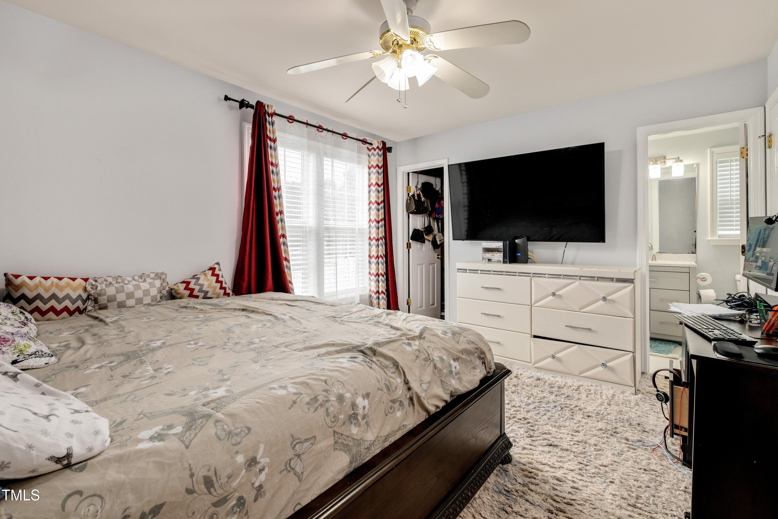 4809 Hallam Way Raleigh, NC 27616 - Photo 11 of 30 a bedroom with a bed and a flat screen tv