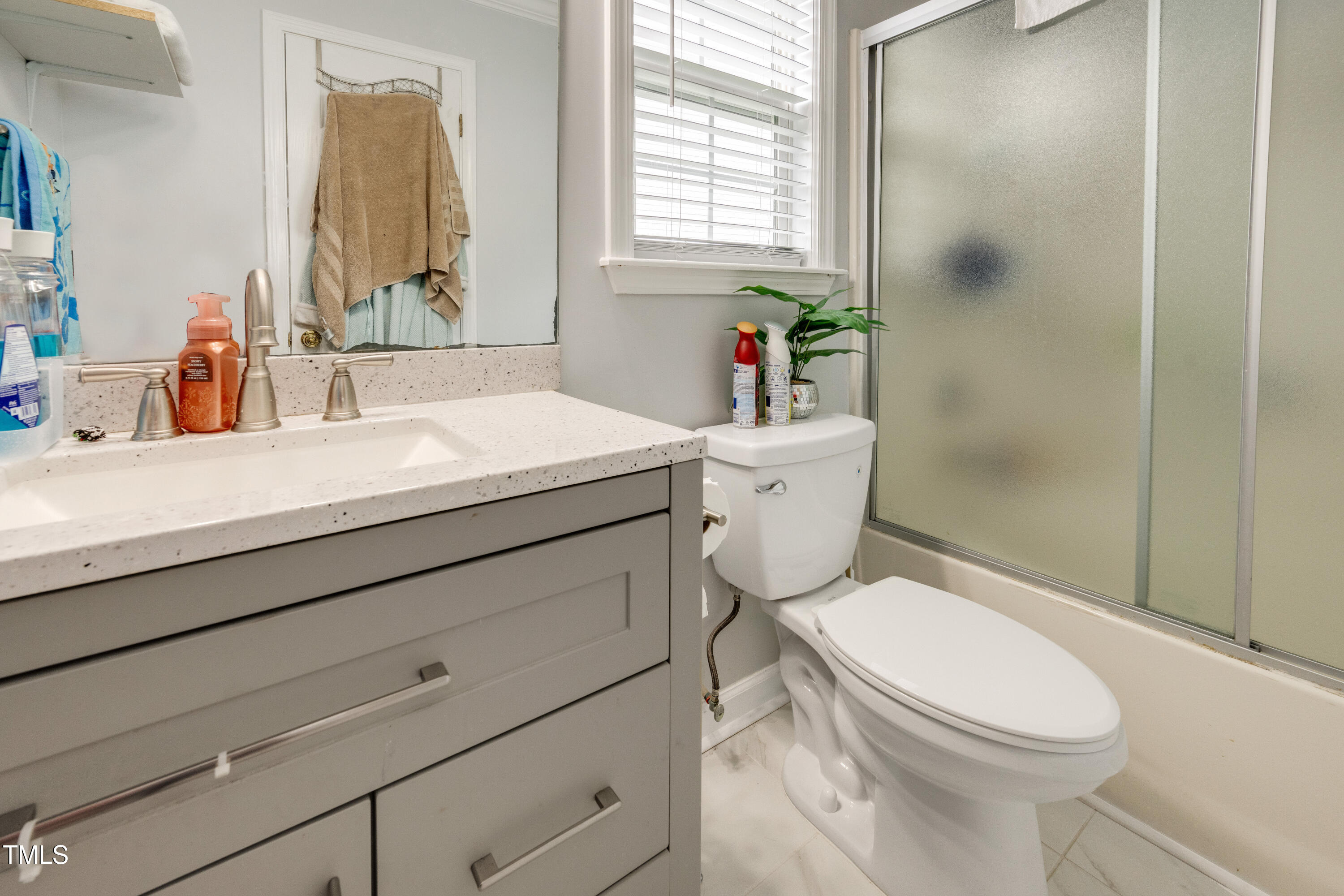 4809 Hallam Way Raleigh, NC 27616 - Photo 12 of 30 a bathroom with a sink toilet and shower
