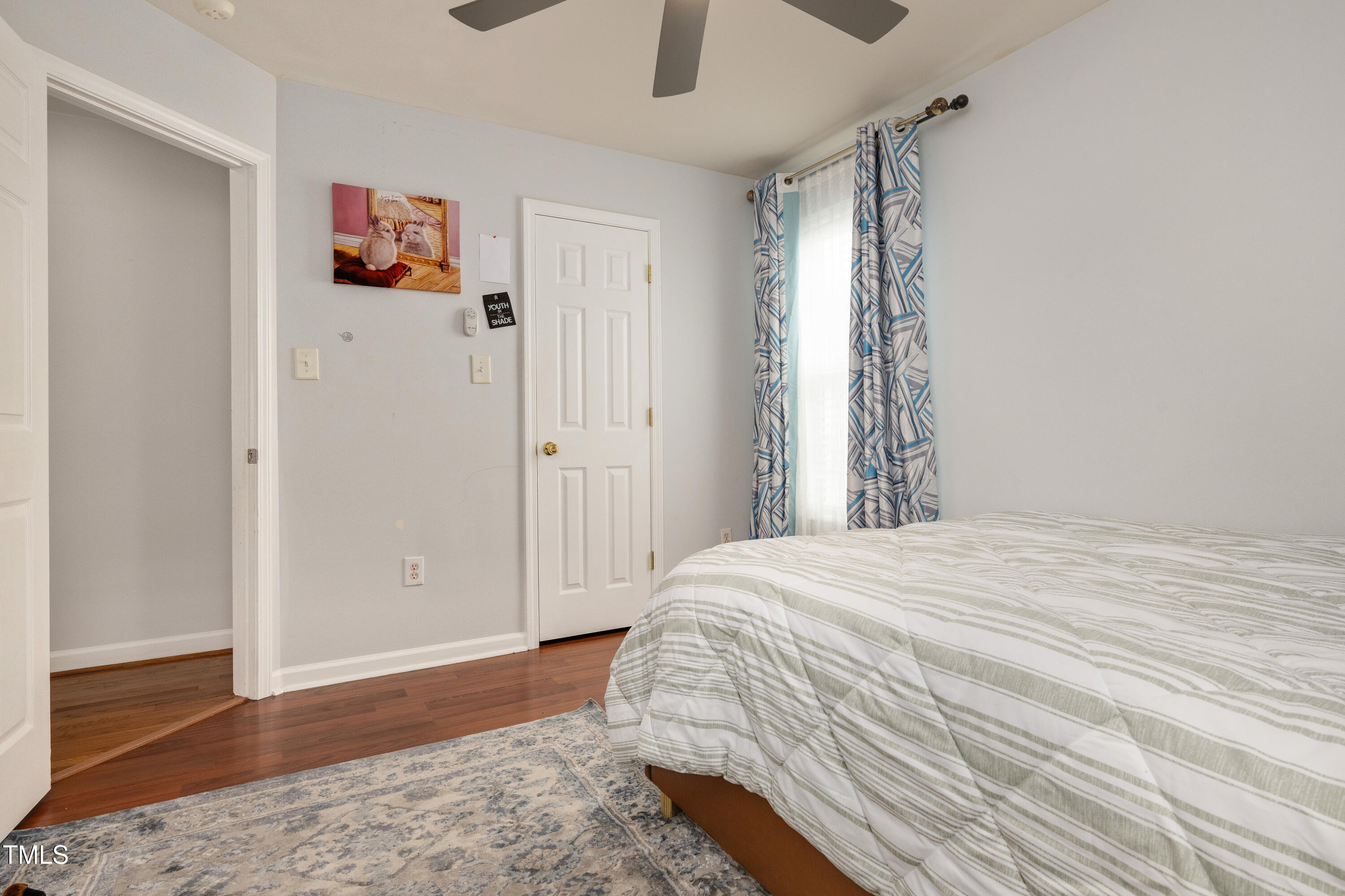 4809 Hallam Way Raleigh, NC 27616 - Photo 15 of 30 a bedroom with a bed and a window