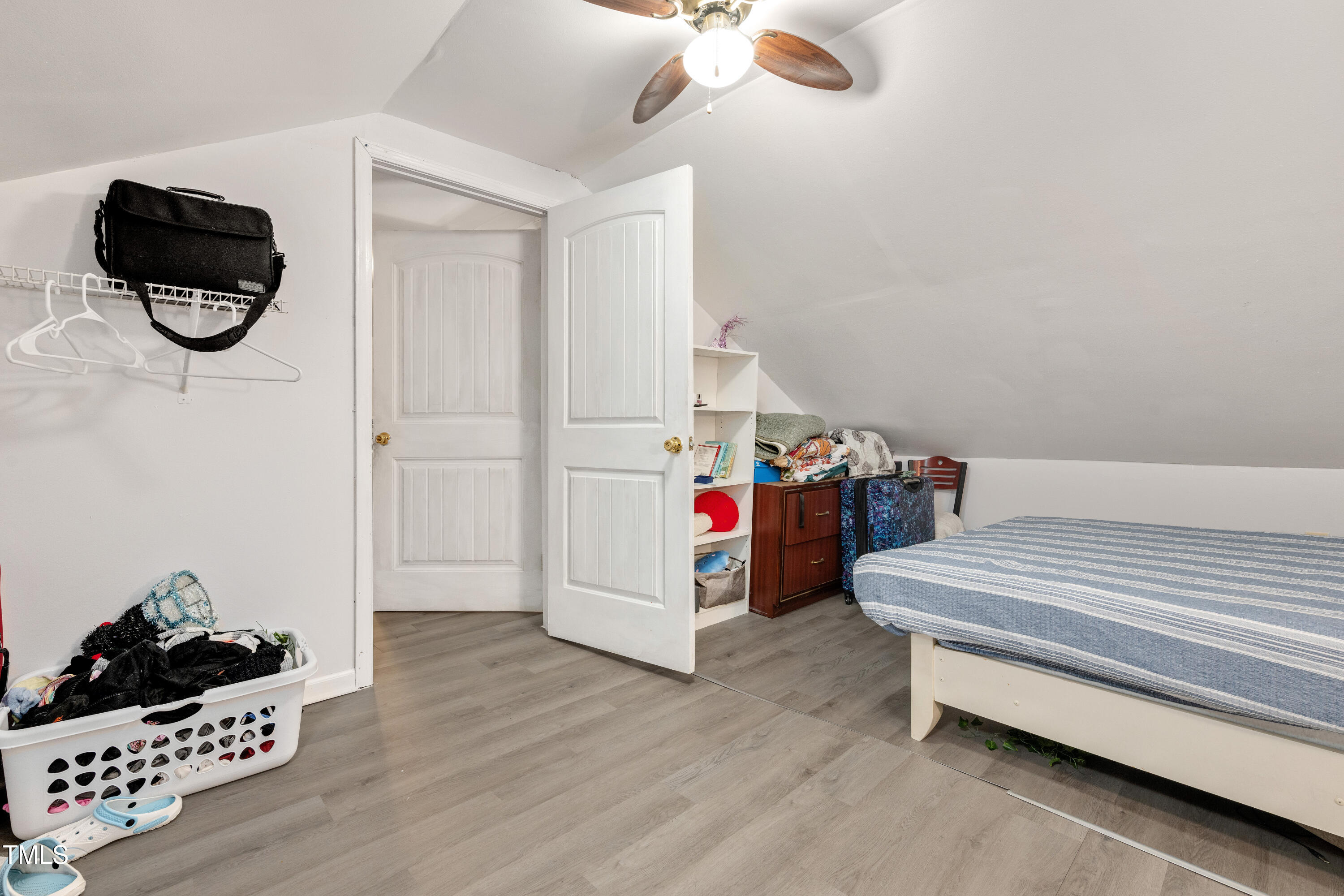 4809 Hallam Way Raleigh, NC 27616 - Photo 18 of 30 a bedroom with a bed and a dresser