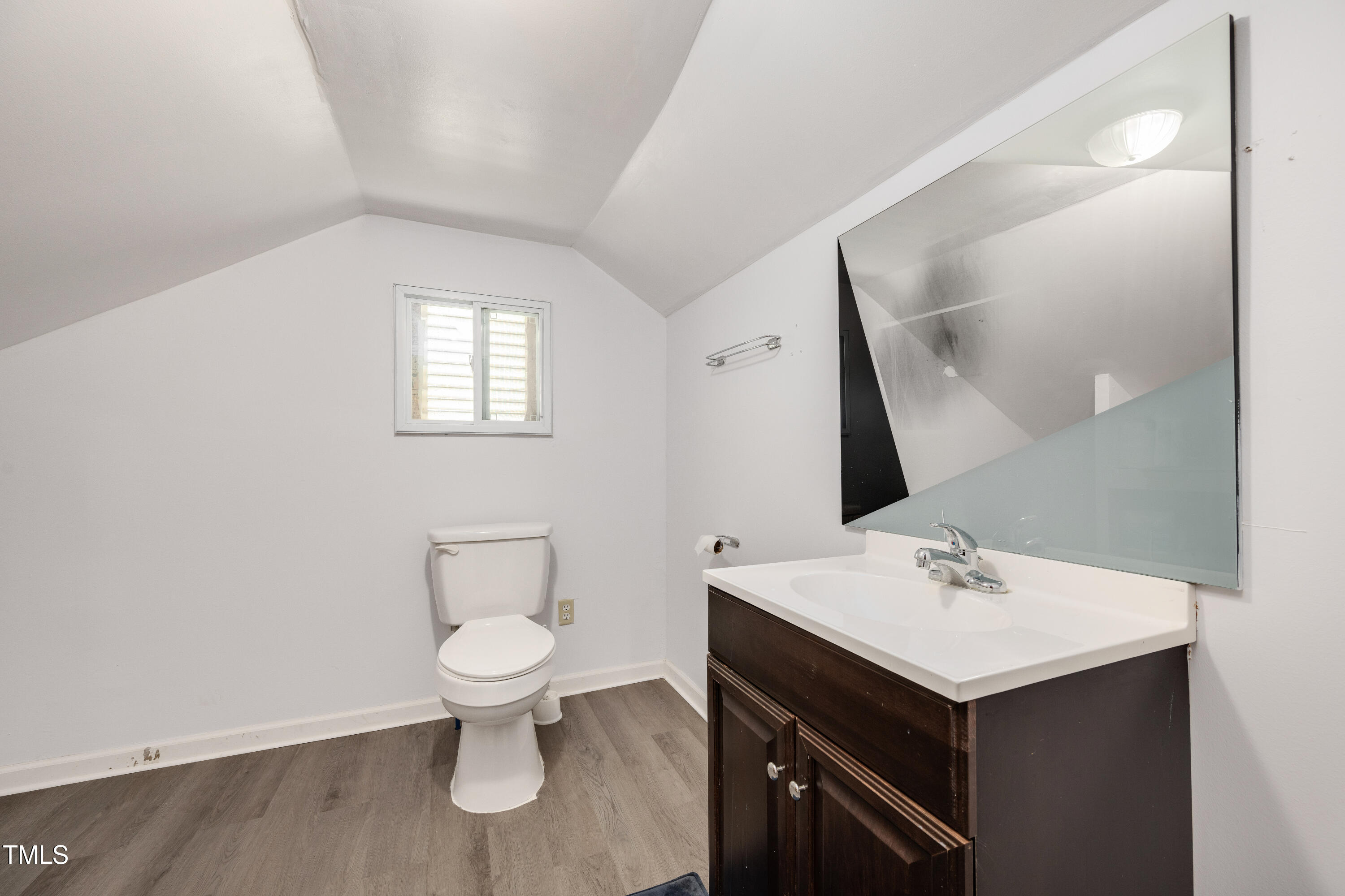 4809 Hallam Way Raleigh, NC 27616 - Photo 21 of 30 a bathroom with a sink toilet and mirror