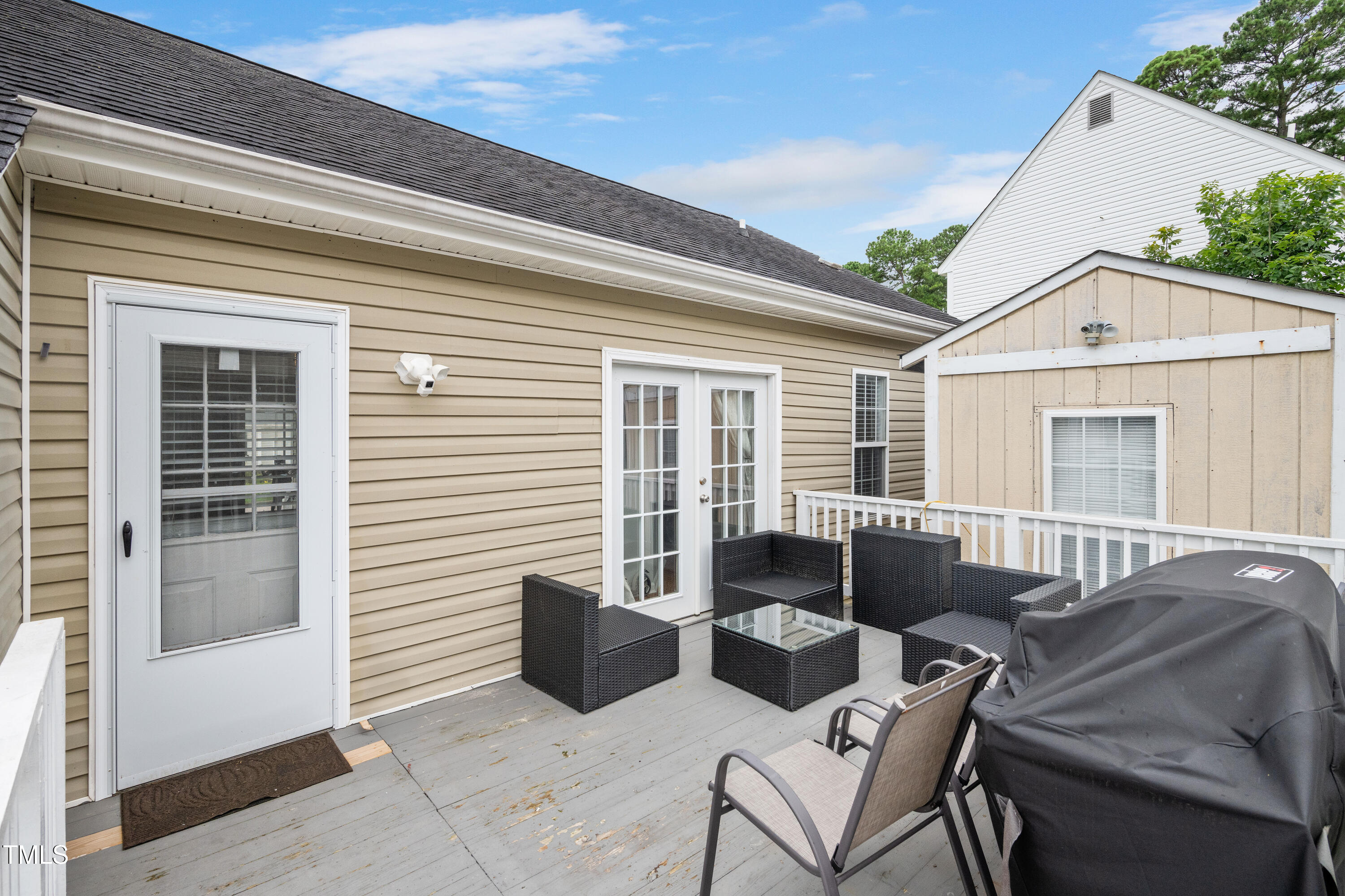 4809 Hallam Way Raleigh, NC 27616 - Photo 26 of 30 a view of a patio with couches table and chairs and potted plants
