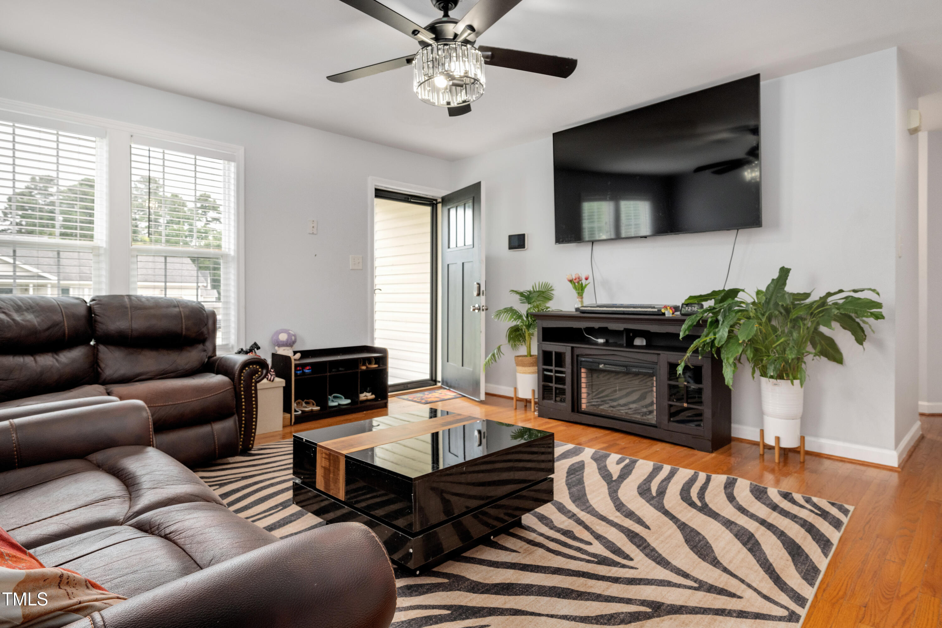 4809 Hallam Way Raleigh, NC 27616 - Photo 4 of 30 a living room with furniture and a flat screen tv