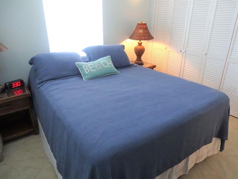6020 Midnight Pass Road, Unit 3 Sarasota, FL 34242 - Photo 5 of 13 a bedroom with a bed and a window