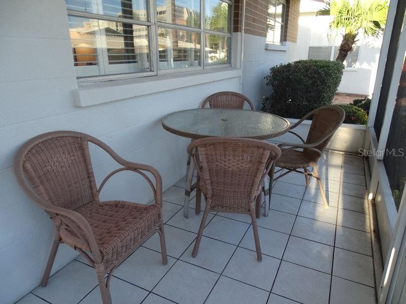 6020 Midnight Pass Road, Unit 3 Sarasota, FL 34242 - Photo 9 of 13 a living room with furniture and a window