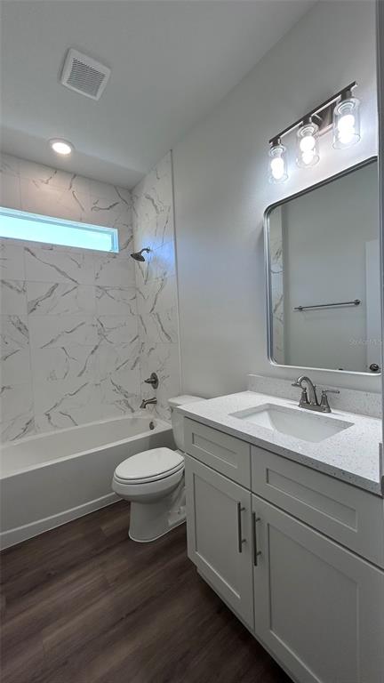 7191 Southwest 133rd Lane Ocala, FL 34473 - Photo 14 of 20 a bathroom with a double vanity sink toilet and a mirror