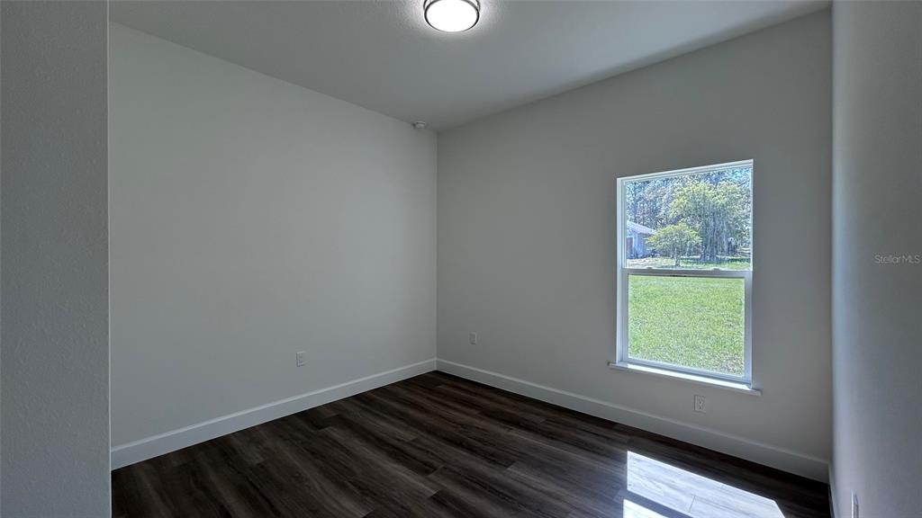 7191 Southwest 133rd Lane Ocala, FL 34473 - Photo 17 of 20 a view of an empty room and window