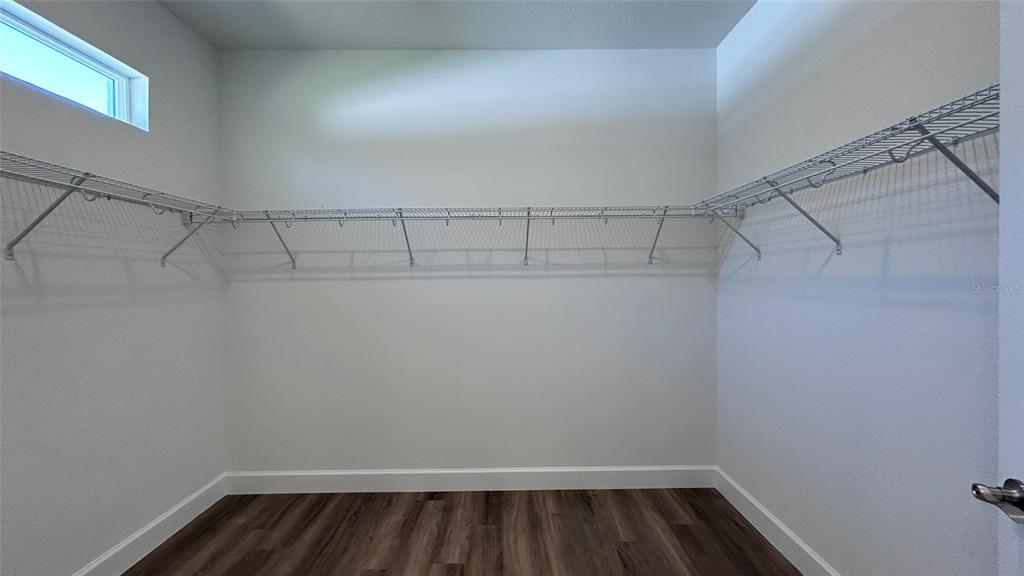 7191 Southwest 133rd Lane Ocala, FL 34473 - Photo 19 of 20 a view of a room with racks on the wall