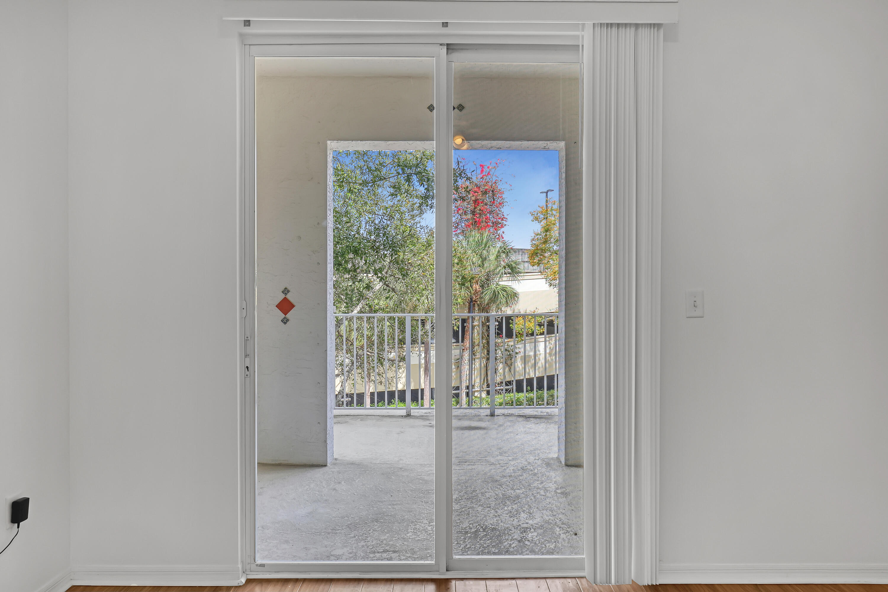 1155 Main Street, Unit 219 Jupiter, FL 33458 - Photo 16 of 25 sliding door to the balcony