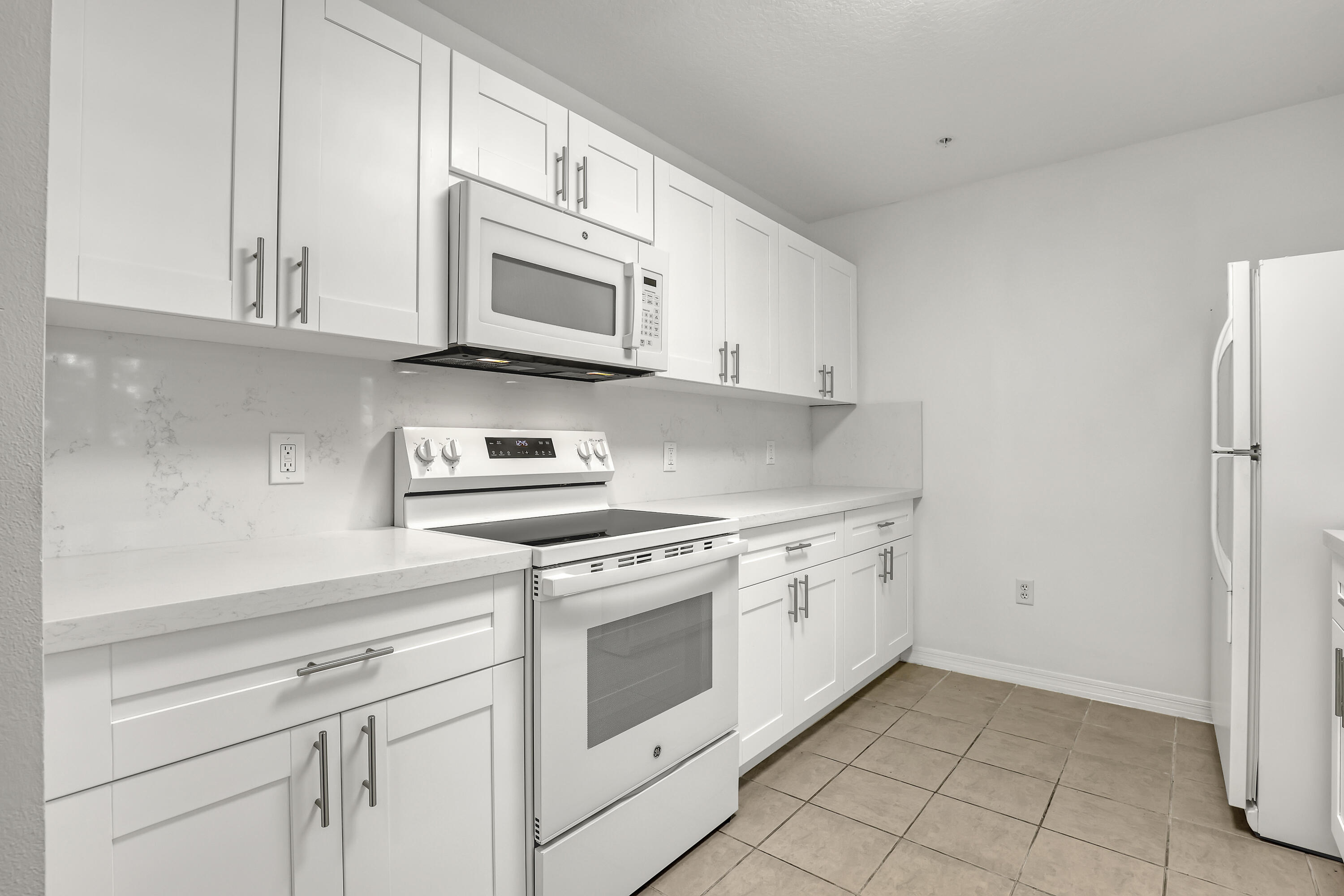 1155 Main Street, Unit 219 Jupiter, FL 33458 - Photo 4 of 25 kitchen view 1