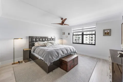 a spacious bedroom with a bed and window