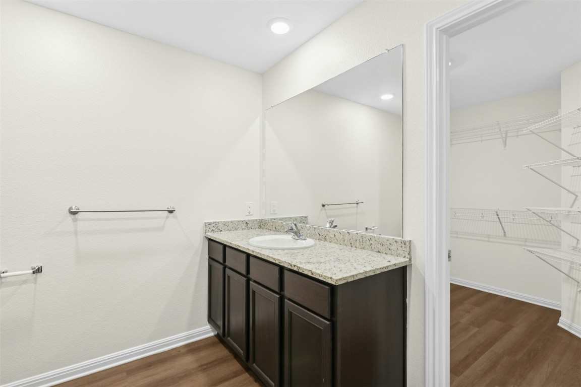 16416 Farmhouse Lane Elgin, TX 78621 - Photo 14 of 25 a bathroom with a sink and a mirror