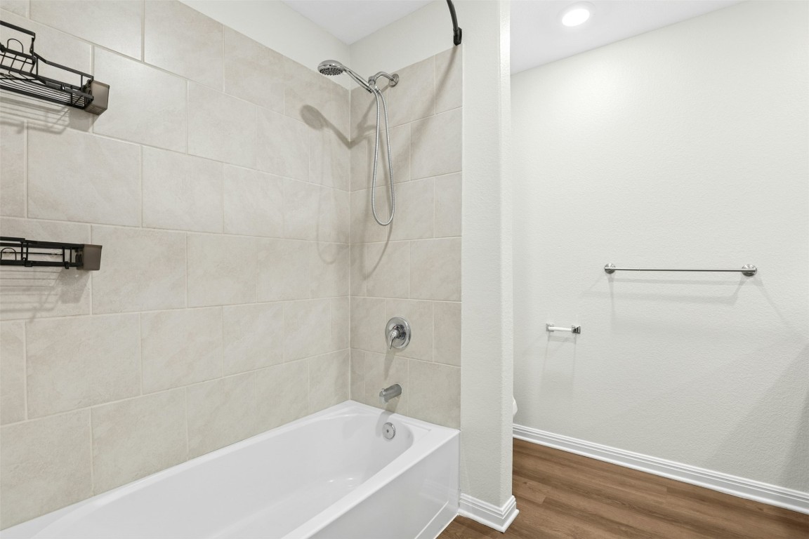 16416 Farmhouse Lane Elgin, TX 78621 - Photo 15 of 25 a bathroom with a bathtub