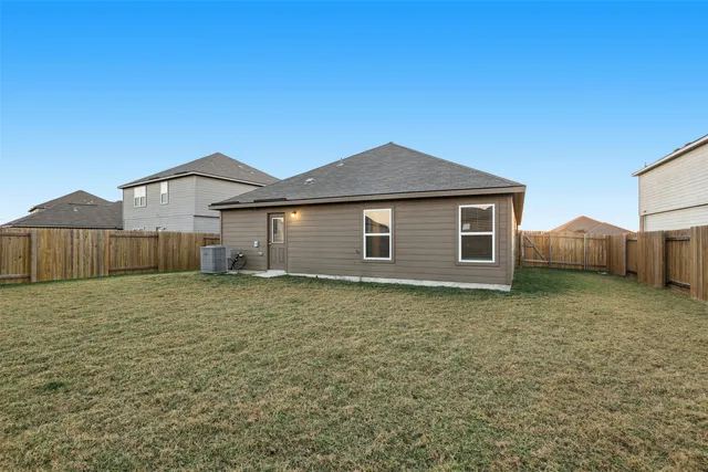 a house view with a backyard space