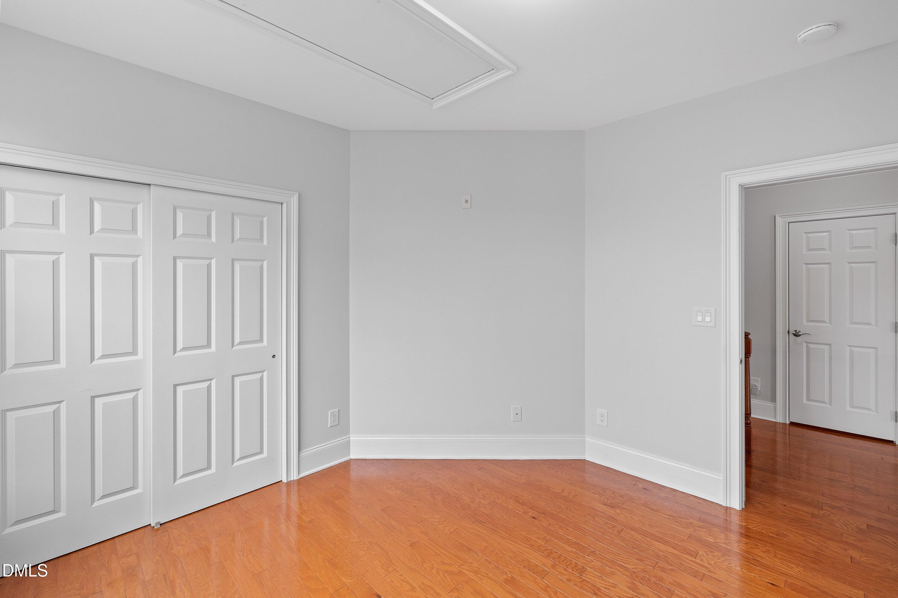 9211 Calabria Drive, Unit 205 Raleigh, NC 27617 - Photo 32 of 55 an empty room with wooden floor