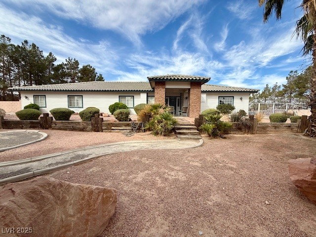 10561 Rancho Destino Road Las Vegas, NV 89183 - Photo 2 of 29 Mediterranean / spanish-style home with a tile roof and fence