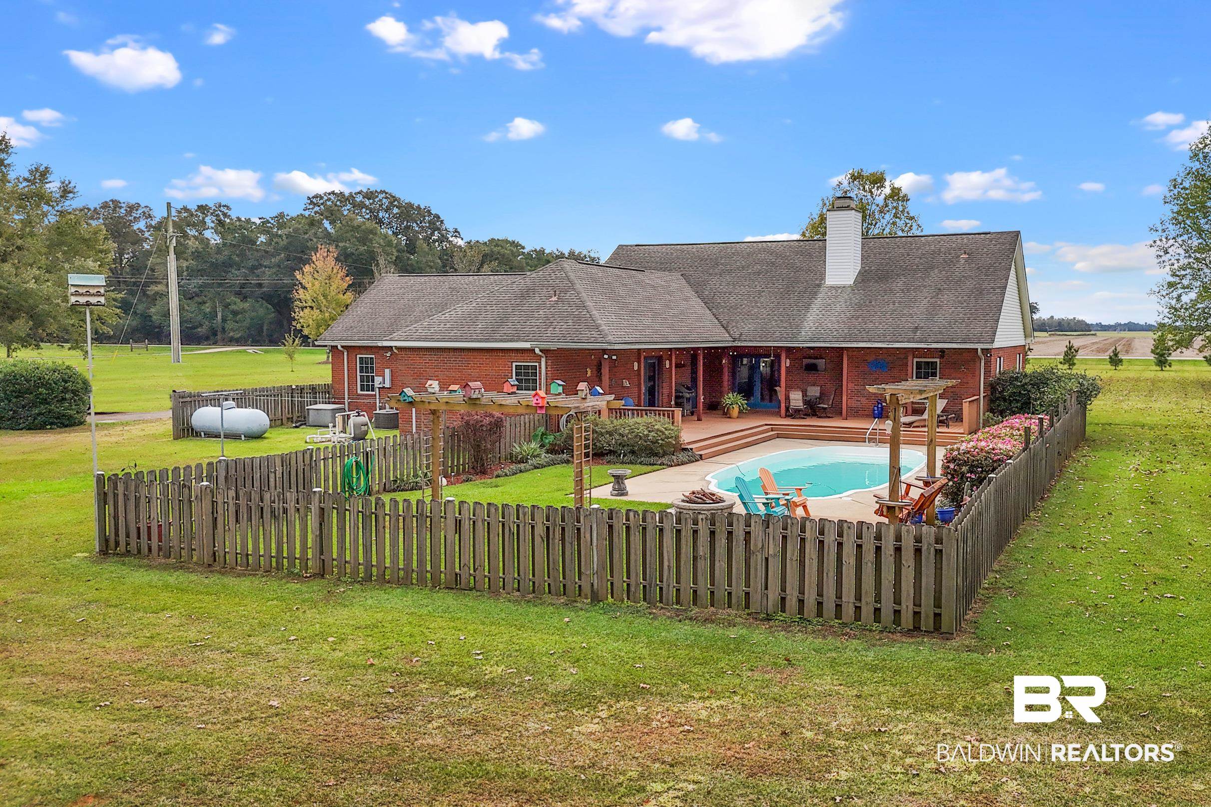 13871 Underwood Road Summerdale, AL 36580 - Photo 24 of 33 View of swimming pool with a yard and a patio area