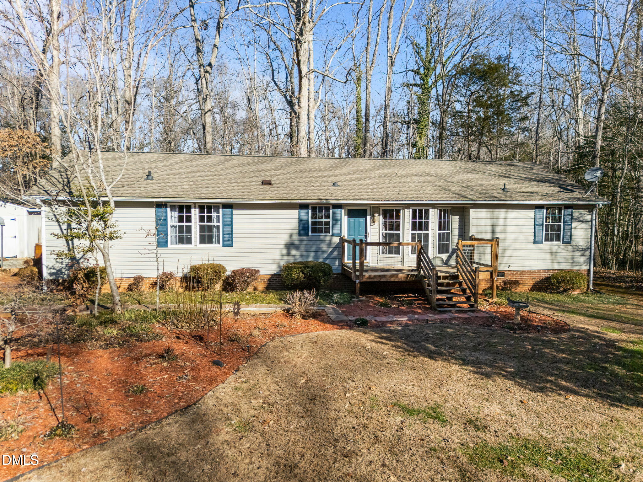 a view of a house with a yard and sitting area