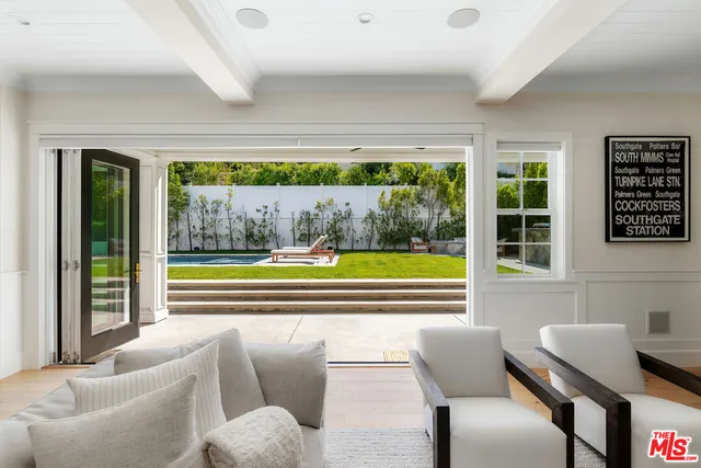 a large kitchen with a table and chairs in it