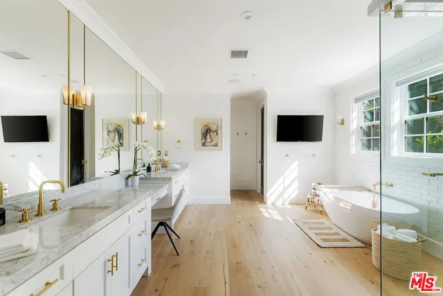 a spacious bedroom with a bed and a window