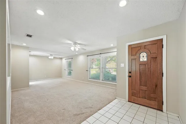 a view of an empty room and window