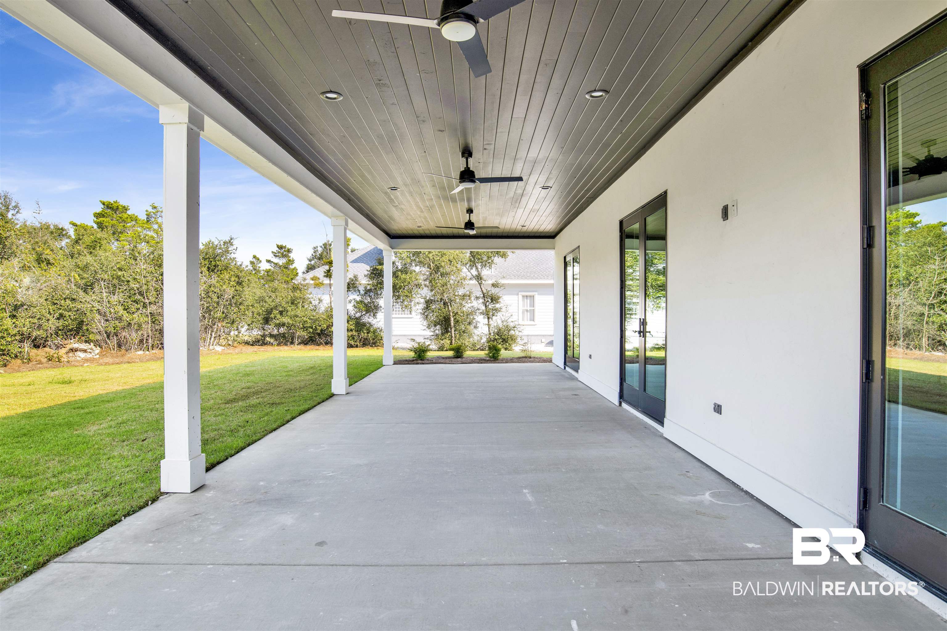 31545 River Road Orange Beach, AL 36561 - Photo 43 of 59 View of covered patio featuring ceiling fan