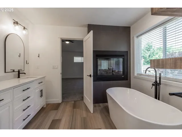 a bathroom with a double vanity sink and mirror