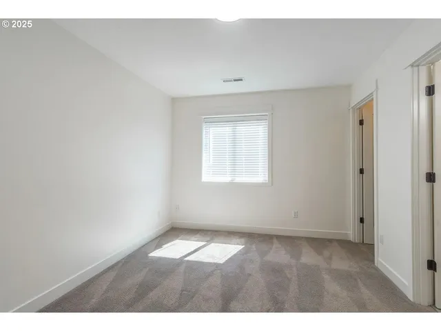 a bathroom with a sink a toilet a mirror and shower