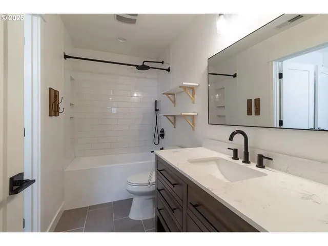 a bathroom with a sink a vanity and a mirror