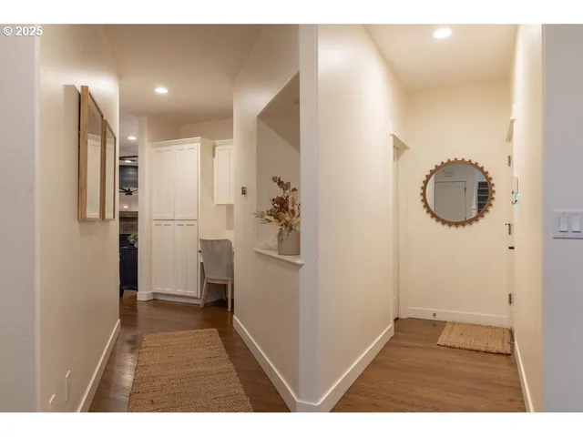 a living room with furniture a rug a stove and a window