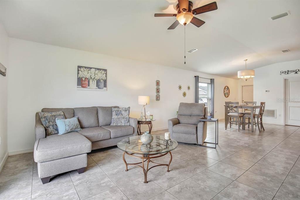 12618 Sandpine Reserve Place Gibsonton, FL 33534 - Photo 13 of 28 a living room with furniture and white walls