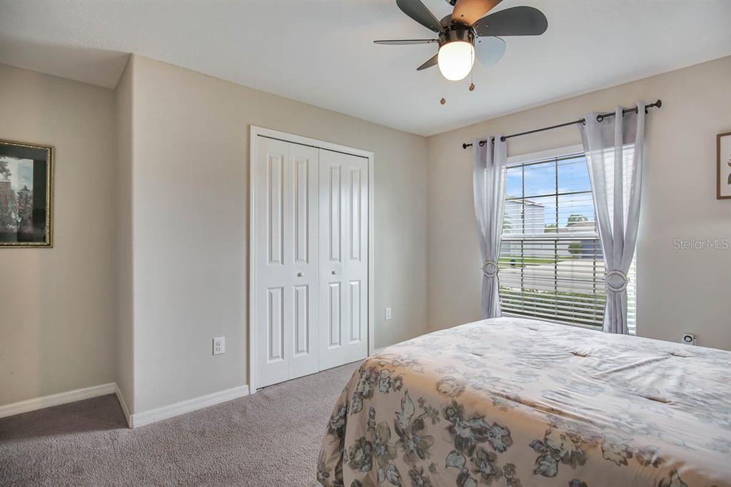 12618 Sandpine Reserve Place Gibsonton, FL 33534 - Photo 23 of 28 a bedroom with a bed and a window