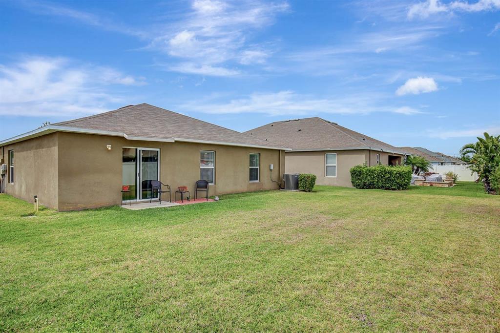 12618 Sandpine Reserve Place Gibsonton, FL 33534 - Photo 26 of 28 a front view of a house with garden