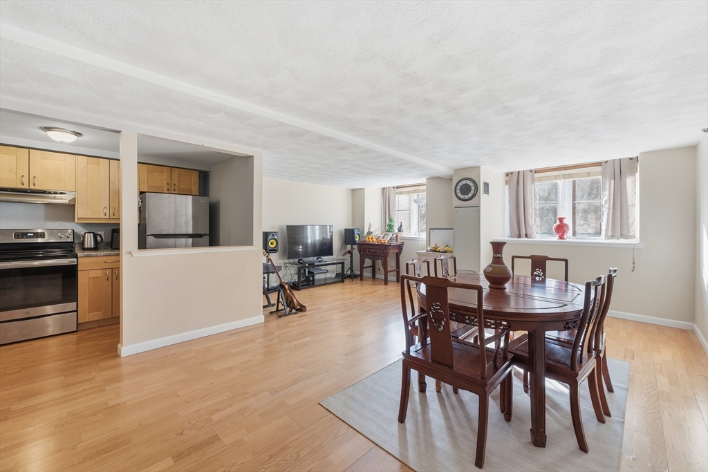 200 Market Street, Unit 217 Lowell, MA 01852 - Photo 12 of 38 a view of a dining room with furniture