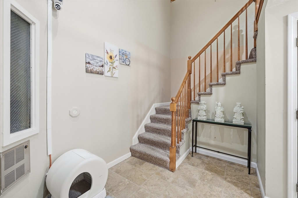 200 Market Street, Unit 217 Lowell, MA 01852 - Photo 14 of 38 a view of entryway and hall with wooden floor