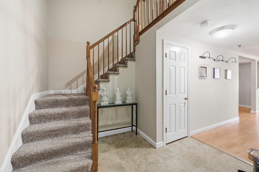200 Market Street, Unit 217 Lowell, MA 01852 - Photo 15 of 38 a view of staircase with white walls and white walls