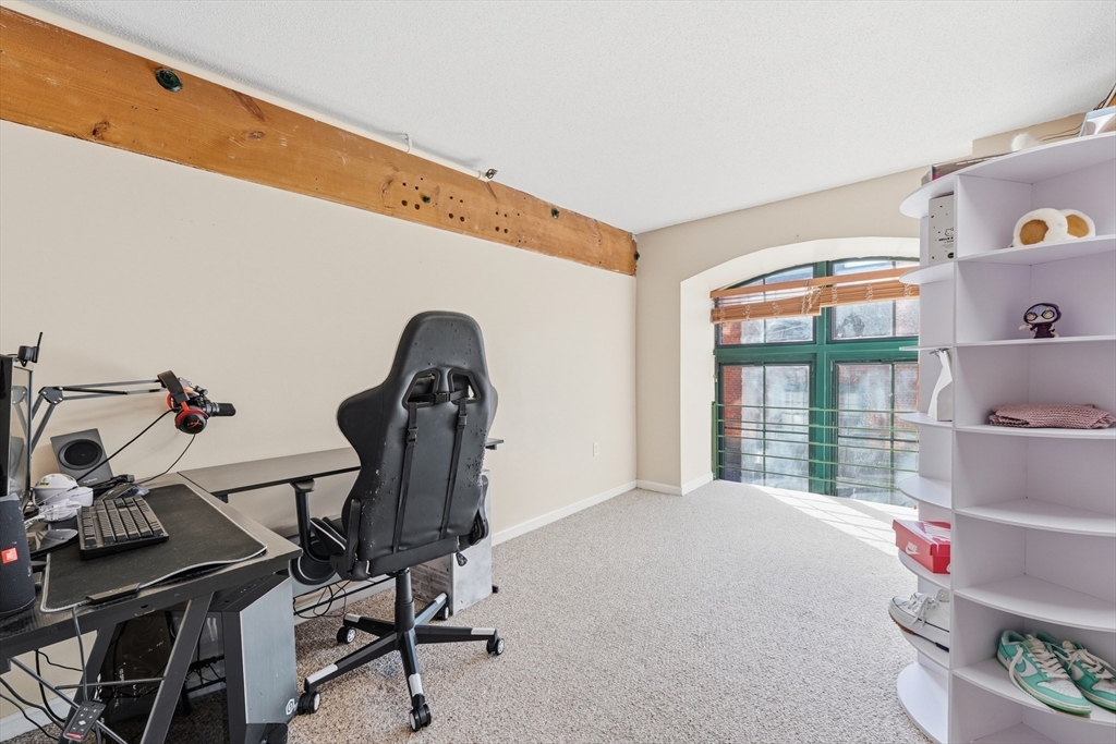200 Market Street, Unit 217 Lowell, MA 01852 - Photo 23 of 38 a view of a room with gym equipment