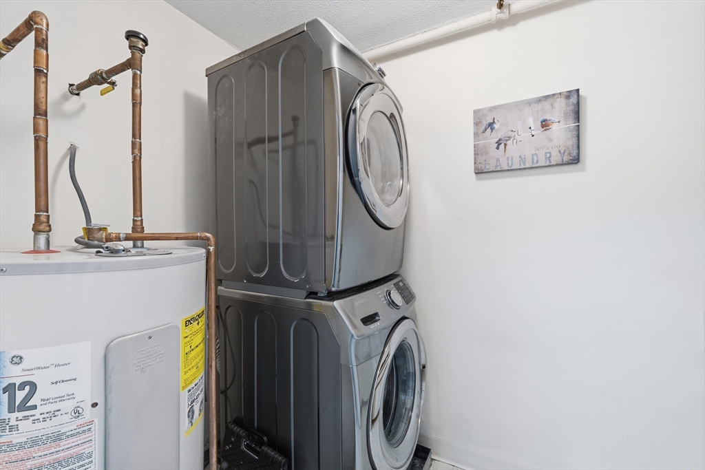 200 Market Street, Unit 217 Lowell, MA 01852 - Photo 24 of 38 a utility room with dryer and washer