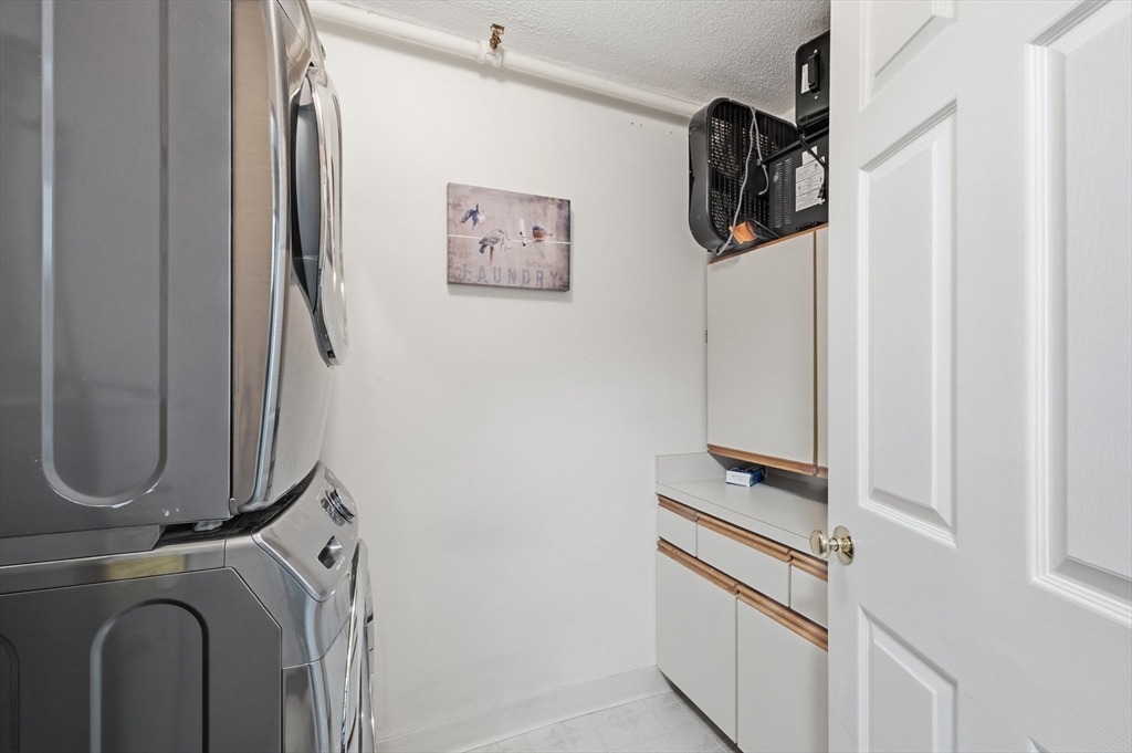 200 Market Street, Unit 217 Lowell, MA 01852 - Photo 25 of 38 a utility room with dryer and washer