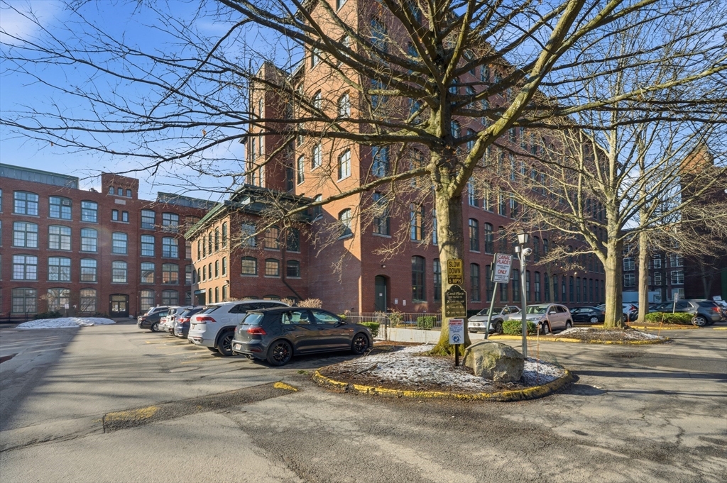 200 Market Street, Unit 217 Lowell, MA 01852 - Photo 30 of 38 a building with trees in front of it