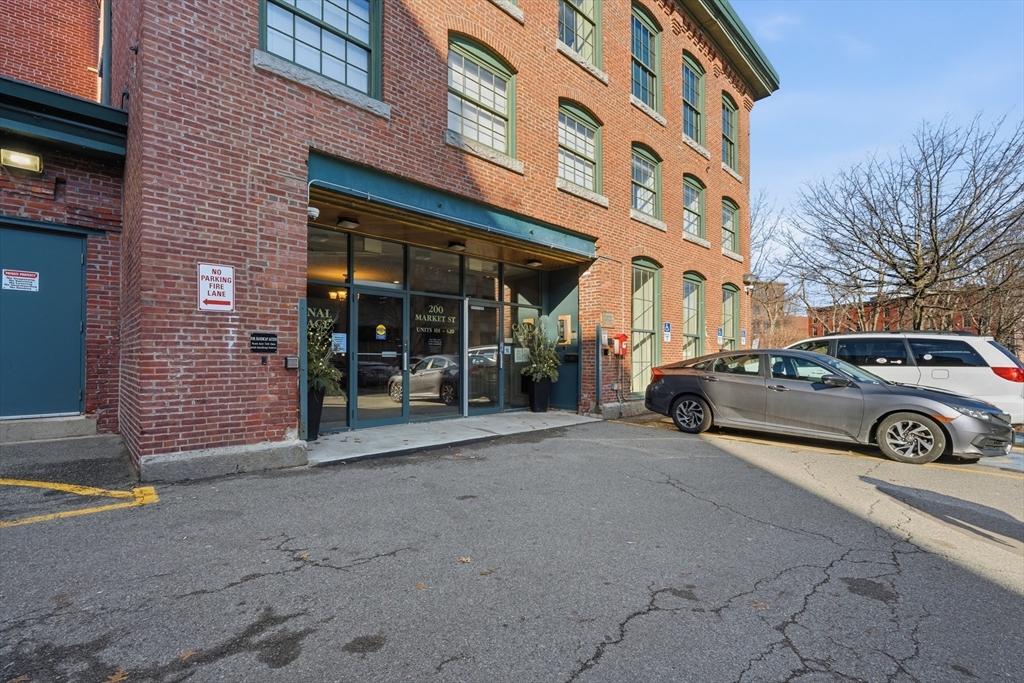 200 Market Street, Unit 217 Lowell, MA 01852 - Photo 32 of 38 a view of a car park in front of building
