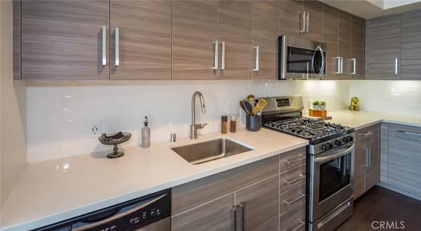 a kitchen with a sink and a large window