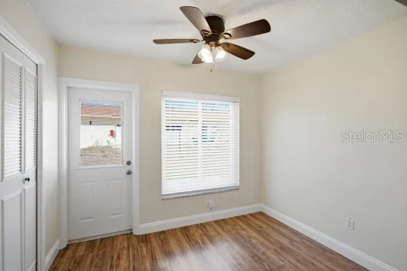 a view of an empty room with a window