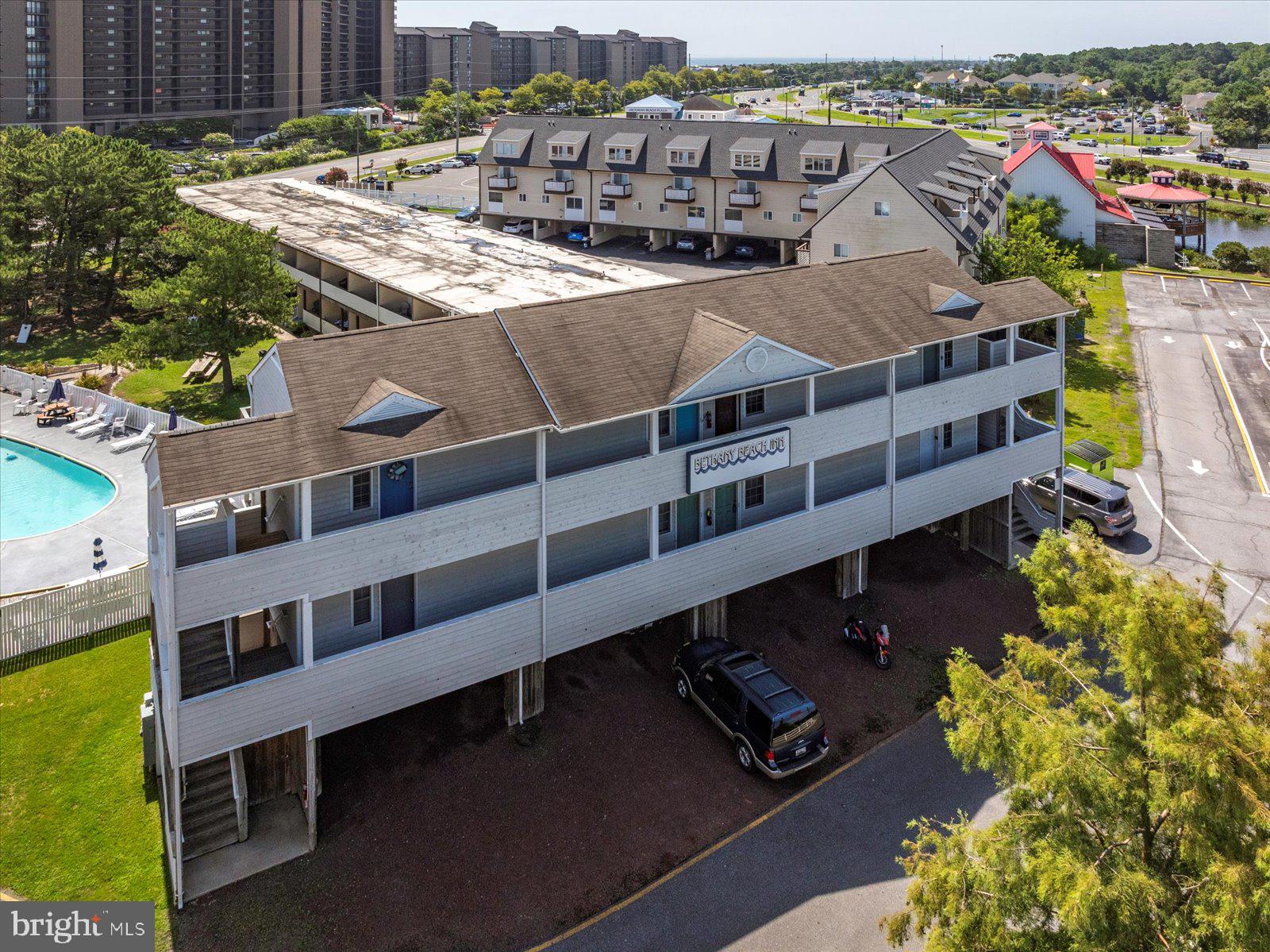 39634 Jefferson Bridge Road, Unit 104 Bethany Beach, DE 19930 - Photo 24 of 28 a view of a city with tall buildings