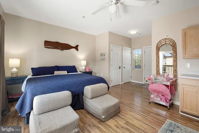 a bedroom with furniture and a large mirror