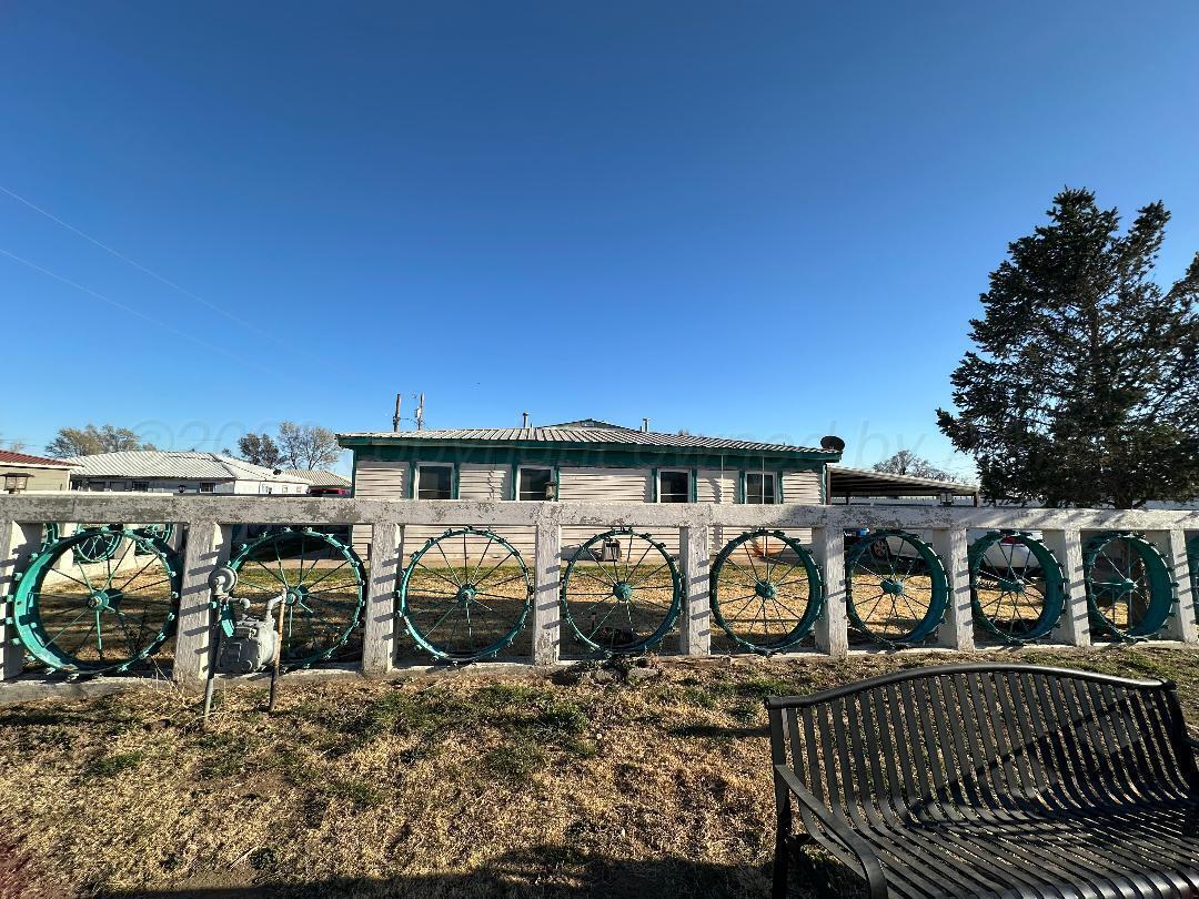 403 Rector Avenue Cactus, TX 79013 - Photo 2 of 3 a view of a house with large trees